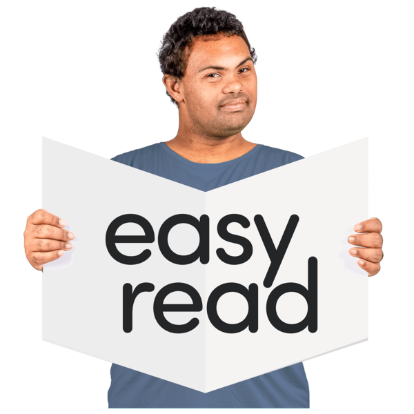 A person holds a leaflet that says easy read