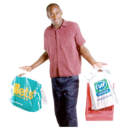 Person holding two shopping bags